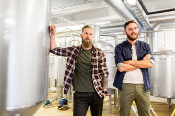 men at craft brewery or beer plant