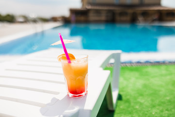 Coctail on lounge zone at pool. Time for summer photo.