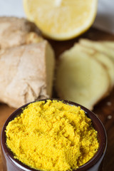 Spices and herbs in ceramic bowls. curcuma and ginger seasoning. Colorful natural additives.