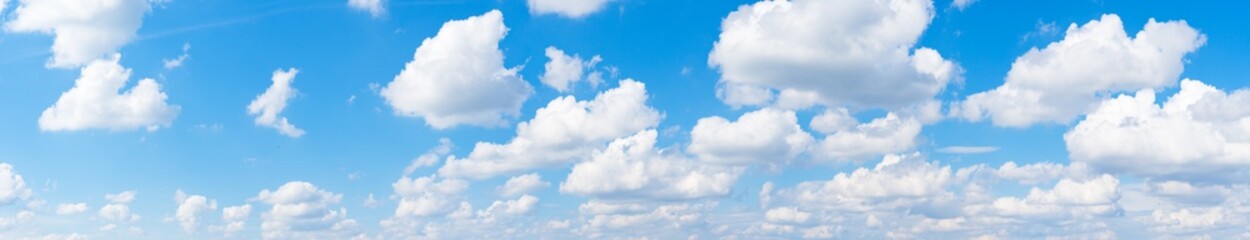 Fototapeta na wymiar Cloudy sky at sunny day panorama
