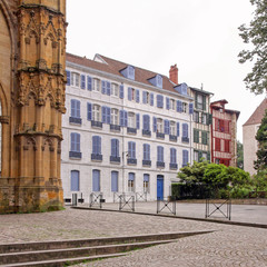Fototapeta premium cathedral detail and public square with traditional houses in bayonne