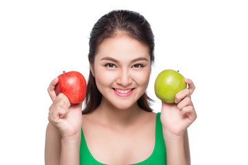 Portrait of asian woman holding red and green apple on white background