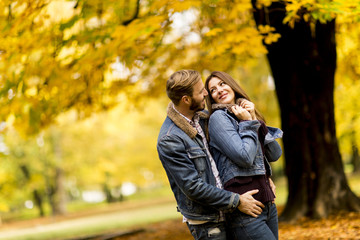 Young loving couple in the autumn park