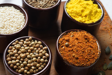 Spices and herbs in ceramic bowls. seasoning. Colorful natural additives.