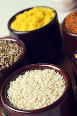 Spices and herbs in ceramic bowls. seasoning. Colorful natural additives.