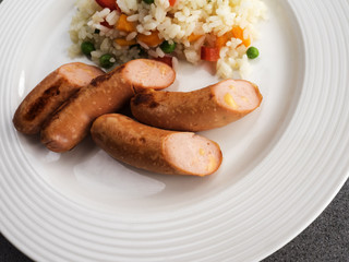 Sausages with boiled rice