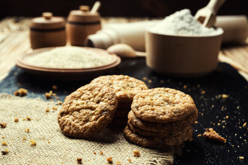 Biscuit sweet cookie background. Domestic stacked butter biscuit pattern concept,close up macro.Homemade cookies on wooden table.Cereal biscuits with the sesame,peanuts,sunflower and amaranth.