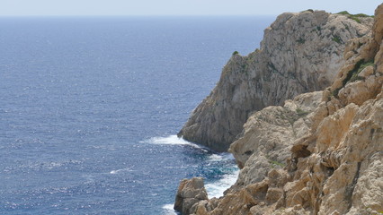 Waves beat against rocks