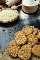 Biscuit sweet cookie background. Domestic stacked butter biscuit pattern concept,close up macro.Homemade cookies on wooden table.Cereal biscuits with the sesame,peanuts,sunflower and amaranth.