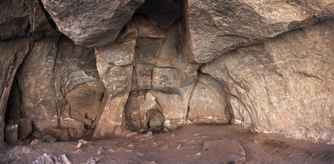 Interior of Sumbay Cave. The walls are covered by rupestrian rock art (hunters, animals) from...