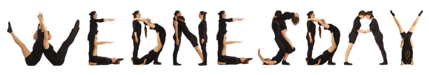 Black dressed people forming WEDNESDAY