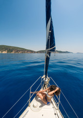 Woman on board of sailing yacht