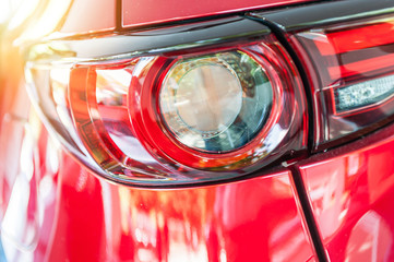 Close up of a red sport car in sunset