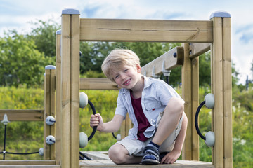 Obraz premium Happy boy on the playground