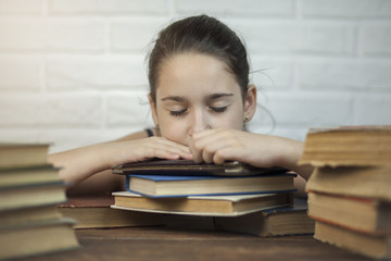 A young student fell asleep at the table