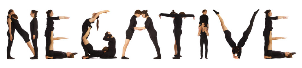 Black dressed people forming NEGATIVE word