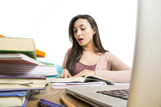 Female student in exams with books