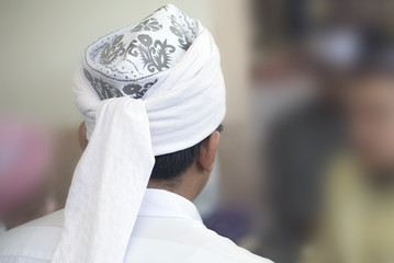 Back view Muslim man wearing turban