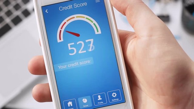Checking credit score on smartphone using application. The result is GOOD