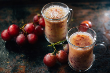Grape smoothie over black metal board