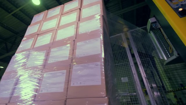 A pallet full of boxes wrapped in stretch film. 
