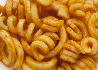 Spiral of french fries on grill