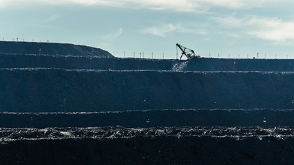 Grader works on dump in the morning