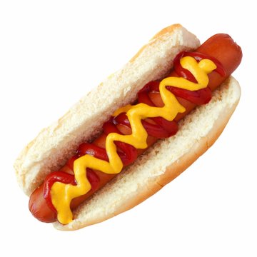 Hot dog with mustard and ketchup, top view isolated on a white background
