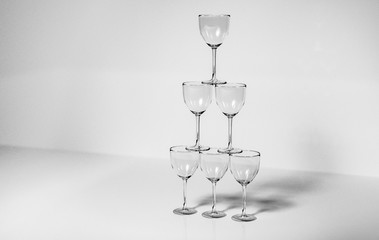 3d render of a pyramid of glasses in monochrome