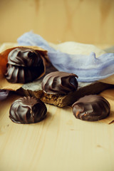 small chocolate-covered cream cake