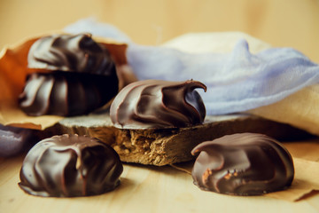 small chocolate-covered cream cake