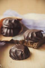 small chocolate-covered cream cake