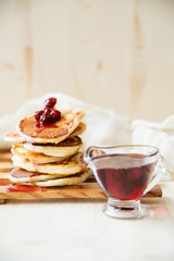 Stack of pancakes with jam and sugar