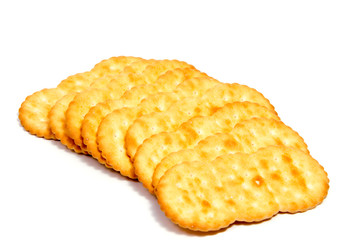 Salted cracker isolated on over white background