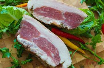Pork pieces are salted in the traditional way.