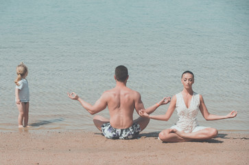 child, man and woman meditating, yoga pose, famile