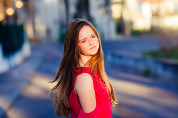 Beautiful child throwing her hair and turning to the camera with