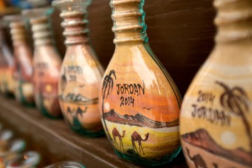 Bottles of colored sand in Jordan