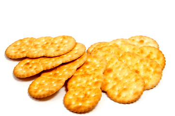 Salted cracker isolated on over white background