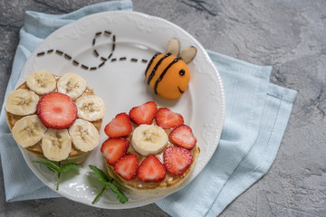 Flowers pancakes with bee for kids breakfast