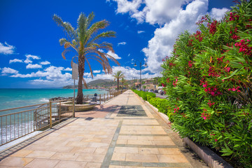 Coastline promenade with palm trees in Cogoleto town on Italien riviera
