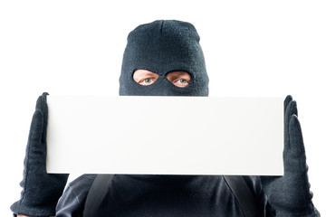 Close-up blank for inscriptions and a portrait of a criminal in a balaclava