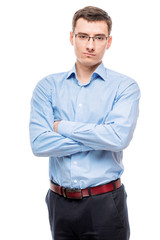 Fototapeta premium Businessman in glasses young and very successful, on a white background in the studio