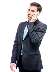 Fototapeta premium Businessman talking on the phone on a white background