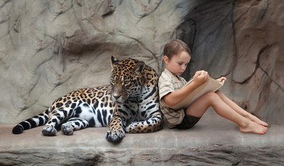 child reading a book and panther - obrazy, fototapety, plakaty