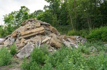 Fototapeta na wymiar demolition / Stack with rubble at the forest 