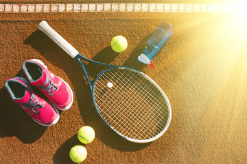Tennis equipment laying on the court