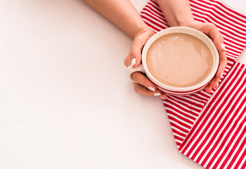 Coffee hands top view white red strips towel