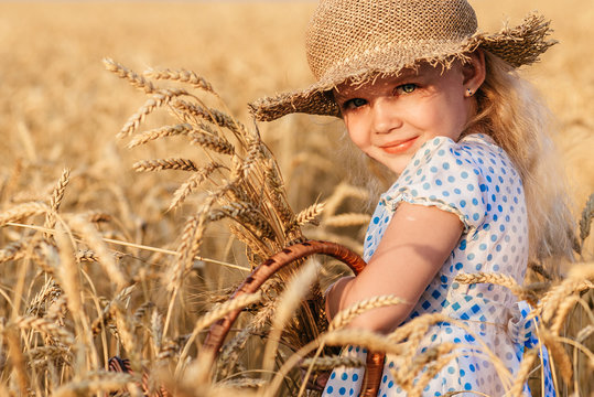 Happy child in autumn wheat field