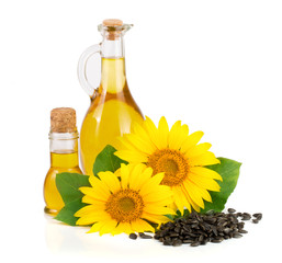 Sunflower oil, seeds and flower isolated on white background